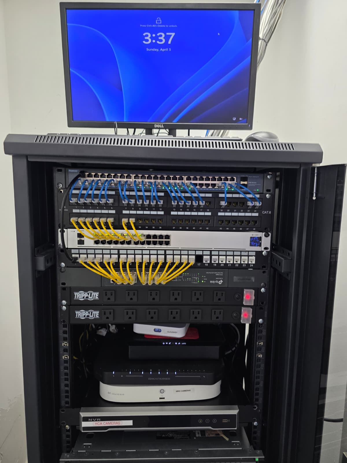 After: clean, labeled and color-coded network rack organized by Anfield IT in a South Florida office