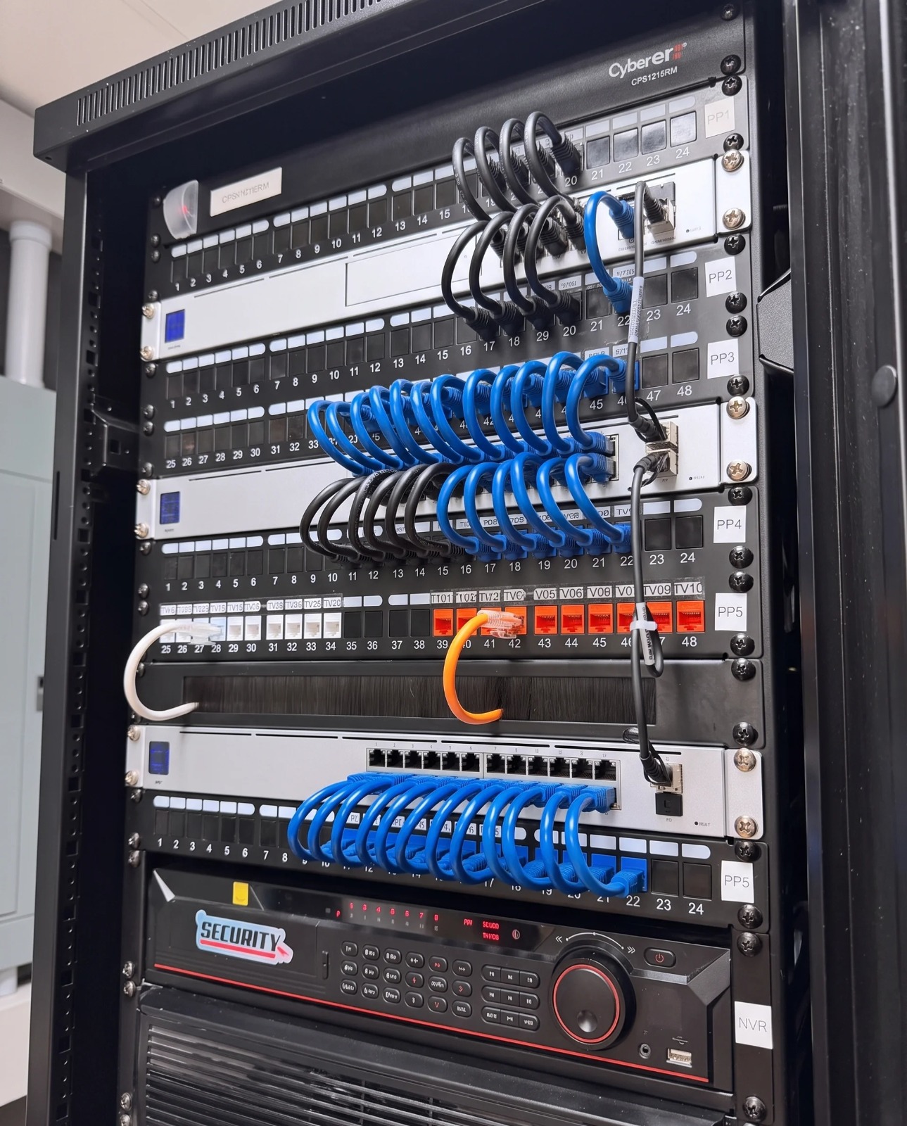 Network rack with structured cabling and CCTV NVR installed by Anfield IT